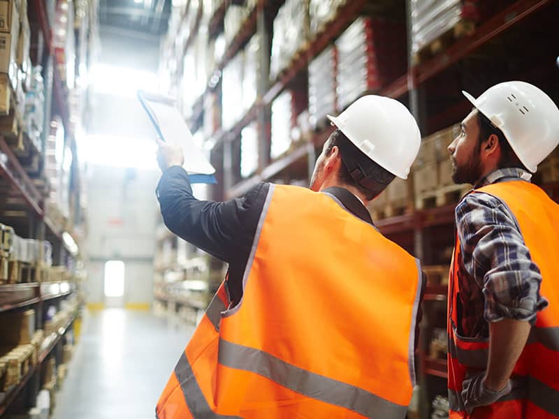 Warehouse employees executing an order fulfillment strategy